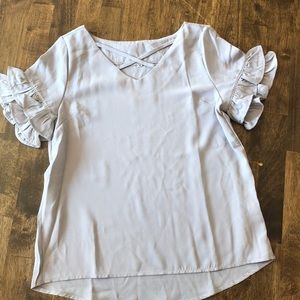 Gray blouse with crisscross neckline